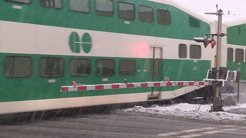 Commuter train at level crossing Stock Footage 71053918