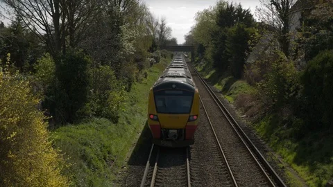 Commuter train passes away from camera Video stock 107323570