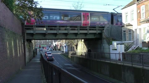 Commuter train passes over a bridge Stock Footage 45550608