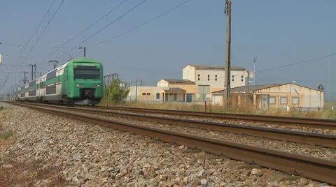 Commuter train passes quickly Stock Footage 881907