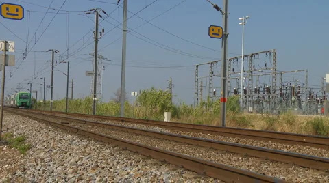 Commuter train passes quickly Stock Footage 921799