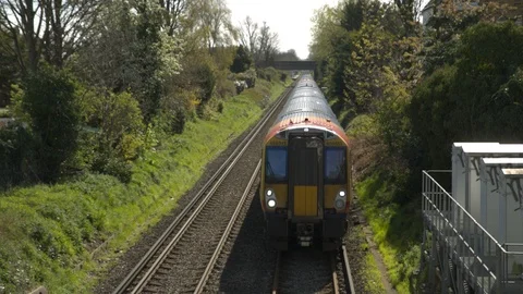 A commuter train passes under the camera Video stock 107322962