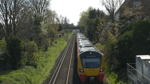 Commuter train passes underneath camera Video stock 107323421