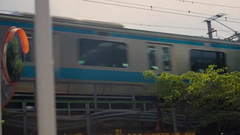 Commuter train passing on a bridge in Tokyo, Japan Stock Footage 340917298