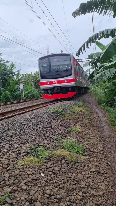 A commuter train passing through Video stock 337818972