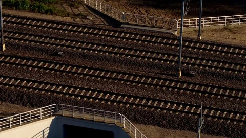 The commuter train is passing through the trees in the morning. Stock Footage 124843316
