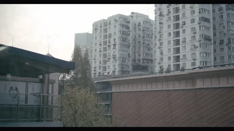 Commuter train pulling into station, Wuhan post-Covid lockdown, China Stock Footage 132585548