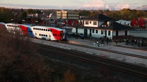 Commuter Train Pulls out from Station Stock Footage 12352186