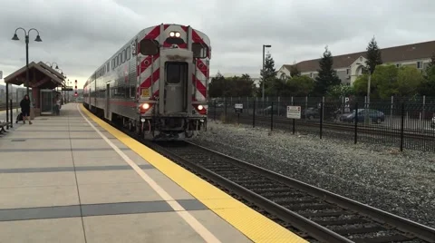 Commuter train pulls into station Stock Footage 44265385