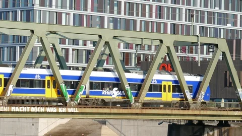 Commuter train on a railway bridge driving, Bremen, Germany, Europe Stock Footage 121145599