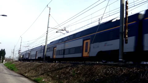 Commuter Train riding from right to left, just left station platform Stock Footage 167658637