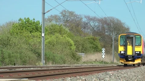 Commuter train rural cxountryside setting movement Stock Footage 49449443