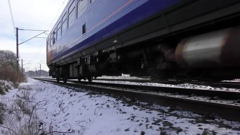 Commuter train snow covered rural landscape Stock Footage 83388584