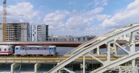 Commuter train speeding over bridge Stock Footage 124007968