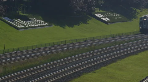 Commuter train on train tracks Stock Footage 44265479