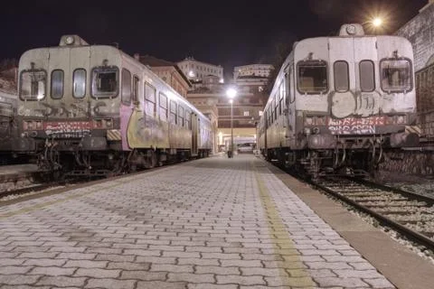 Commuter trains pulling into a empty station. 스톡 사진