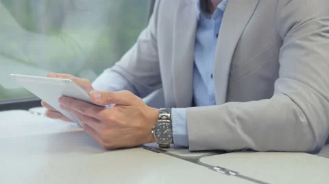 Commuter using his tablet on the way to a job Stock Footage 67261370