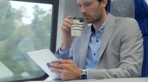 Commuter using his tablet on the way to a job Stock Footage 67261600