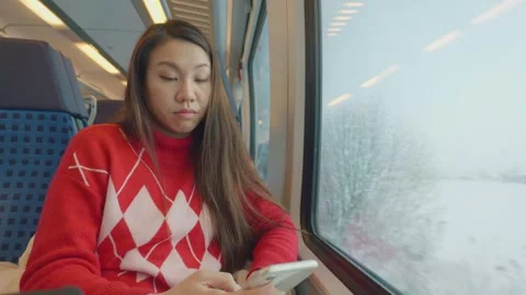 Commuter Using Phone on a Train Journey Stock Footage 335588244