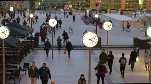 Commuters and clocks Stock Footage 58849446