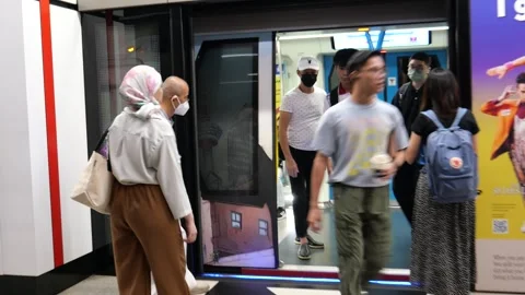 Commuters and Metro train in Kuala Lumpur, Malaysia Stock Footage 266921590