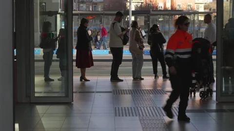 Commuters and security guard at a busy transportation station Stock-Footage 329592837