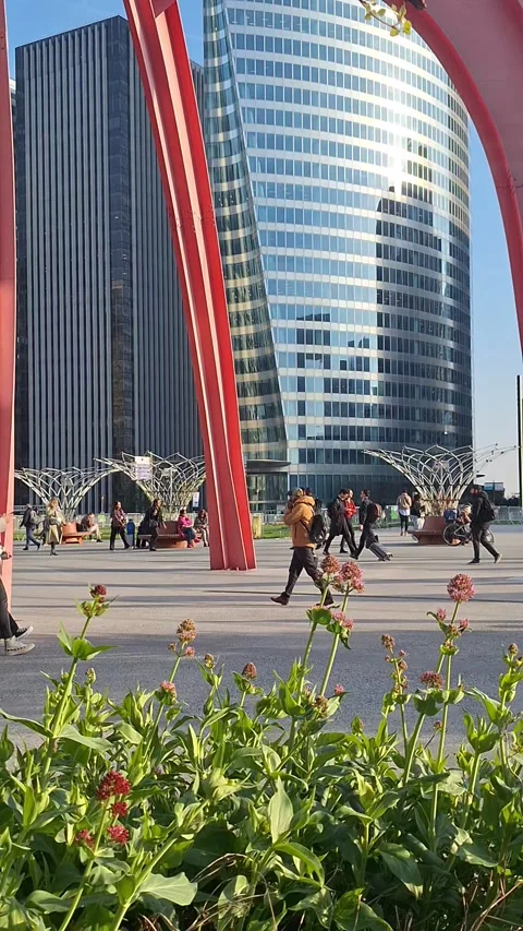 Commuters and spring flowers in La Defense district Paris Video stock 332726013