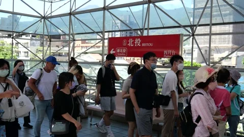 Commuters at Beitou MRT city train station in Taipei Stock-Footage 264289476