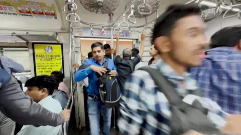 Commuters Board Train at Dadar railway Platform. 4K (Over crowded train) Stock Footage 252345938
