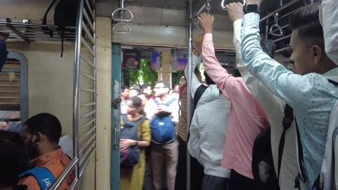 Commuters Board Train at Dadar railway Platform. 4K (Over crowded train) Stock Footage 253254959
