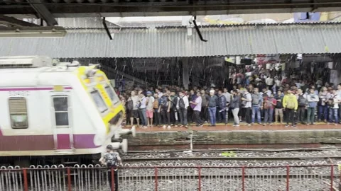 Commuters Board Train at Dadar railway Platform. 4K (Over crowded train) Stock Footage 253254997