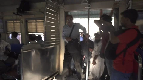 Commuters Board A Train in India  Stock Footage 90965043
