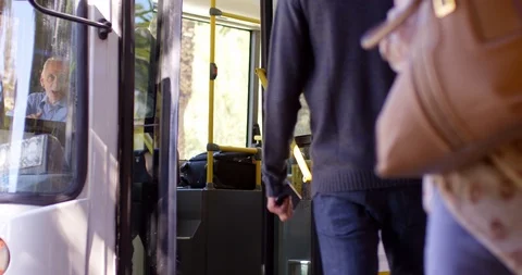 Commuters boarding bus 4k Stock Footage 97783088