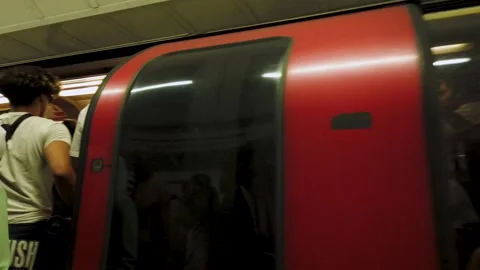 Commuters boarding Jubilee Line train, London Underground, Bond Street Video stock 217400797