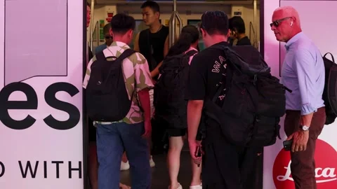 Commuters Boarding a Skytrain at a Busy Station in Bangkok Thailand Stock Footage 327249156