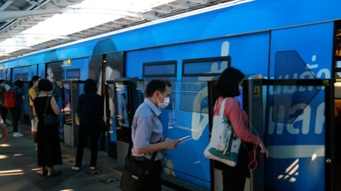 Commuters at BTS skytrain in Bangkok Stock Footage 127082837