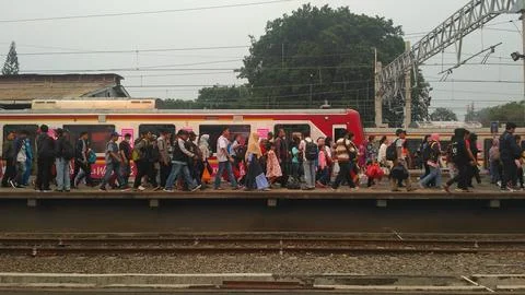 Commuters at a Busy Train Station Platform Stock Photos