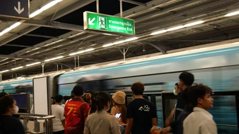 Commuters at city skytrain station Stock Footage 256292883