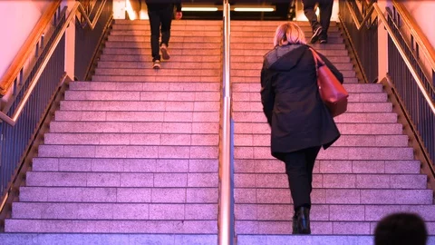 Commuters climbing stairs to train platform Stock Footage 94846363