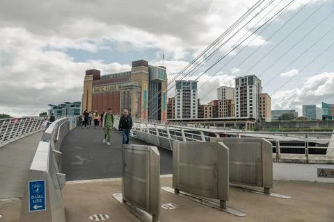 Commuters crossing the Newcastle Millenium Bridge Stock Photos
