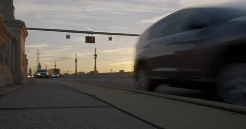 Commuters driving over bridge with sun rising 4K Stock Footage 58558314