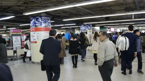 Commuters during rush hour in busy Osaka subway station. Stock Footage 25821472