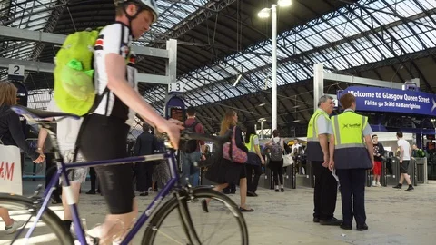 Commuters During Rush Hour Inside Queen Street Railway Station in Glasgow Stock Footage 119146132
