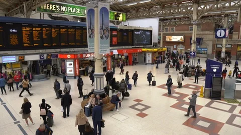 Commuters During Rush Hour at Victoria Railway Station in London, UK Stock Footage 112125657