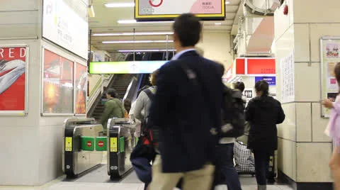 Commuters enter and exit Tokyo subway station. Stock Footage 25822231