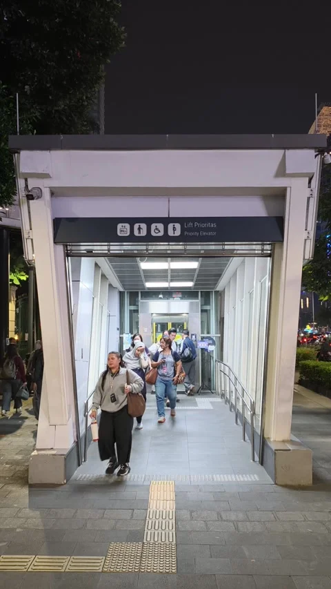 Commuters Exiting Jakarta MRT Station Using Priority Elevator Stock Footage 338316481