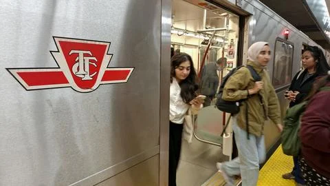 Commuters exiting a subway train in Toronto. 스톡 사진