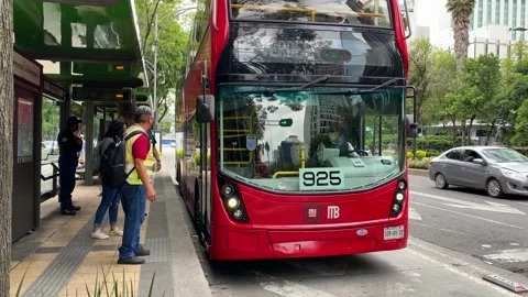 Commuters get on a public double decker bus in Mexico City, 4K Stock Footage 159028815