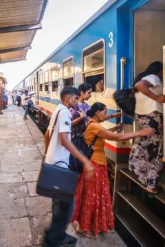 Commuters getting on a train Photos