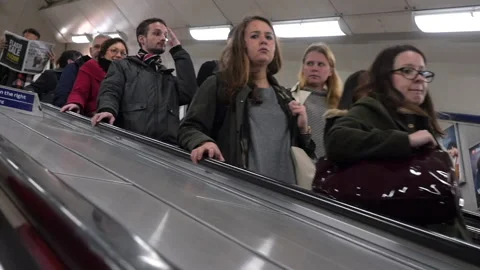 Commuters Going Down On Escalator In The London Underground HD Stock Footage 131171947